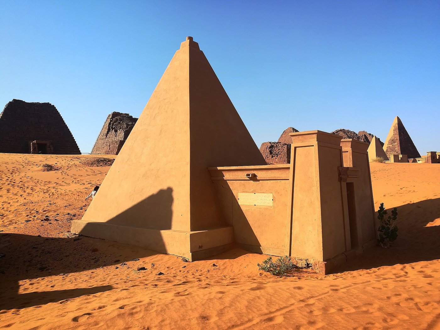 Steep, narrow pyramids of the royal cemetery at Meroe rising from the desert in Sudan