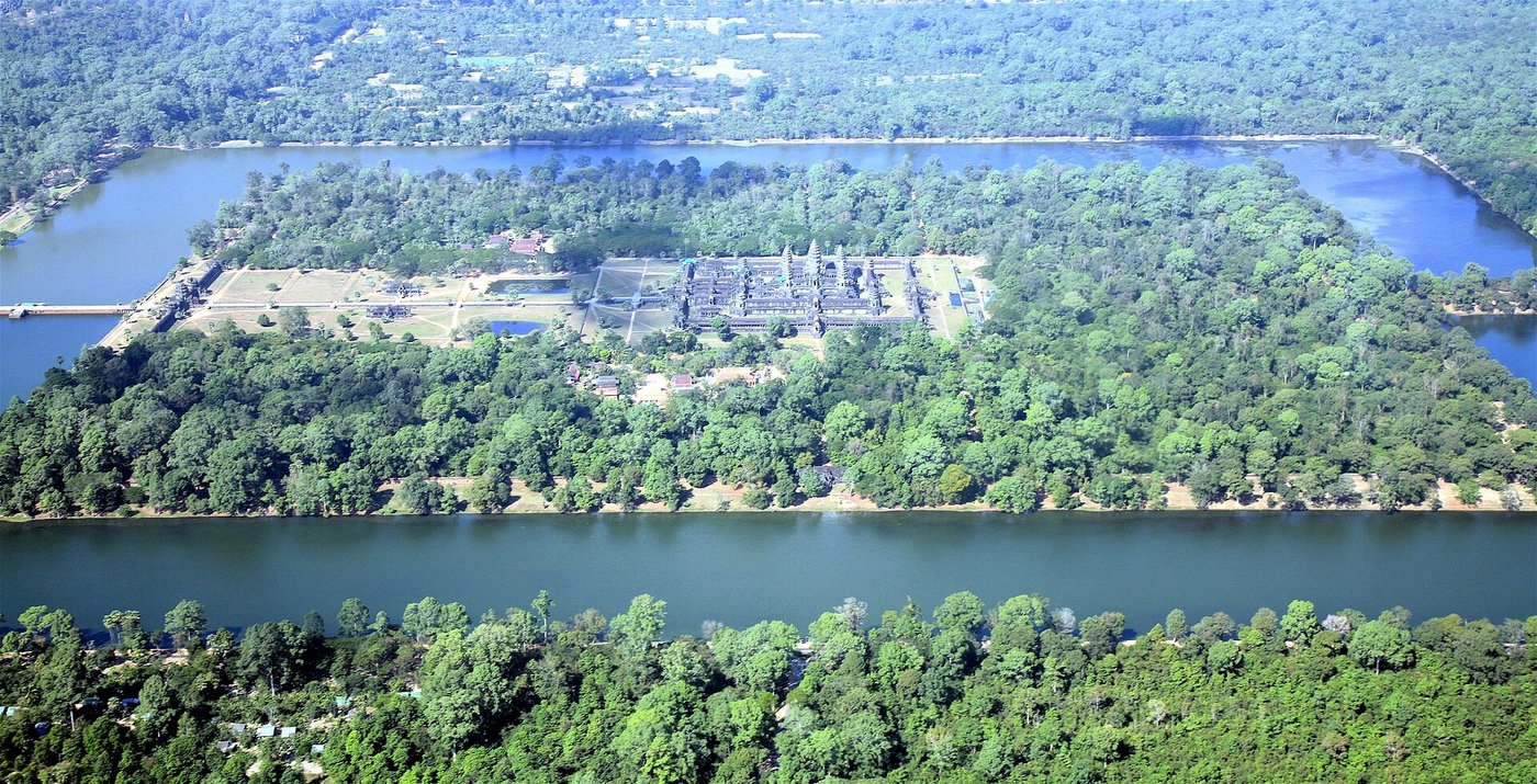 Aerial view of Angkor Wat surrounded by its wide rectangular moat and forest