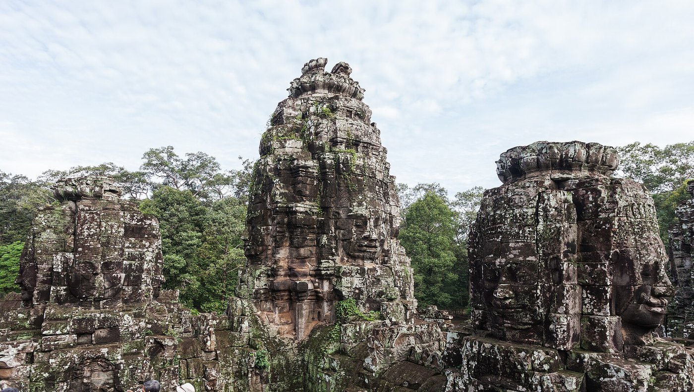 The great stone faces on the towers of the Bayon temple at Angkor Thom
