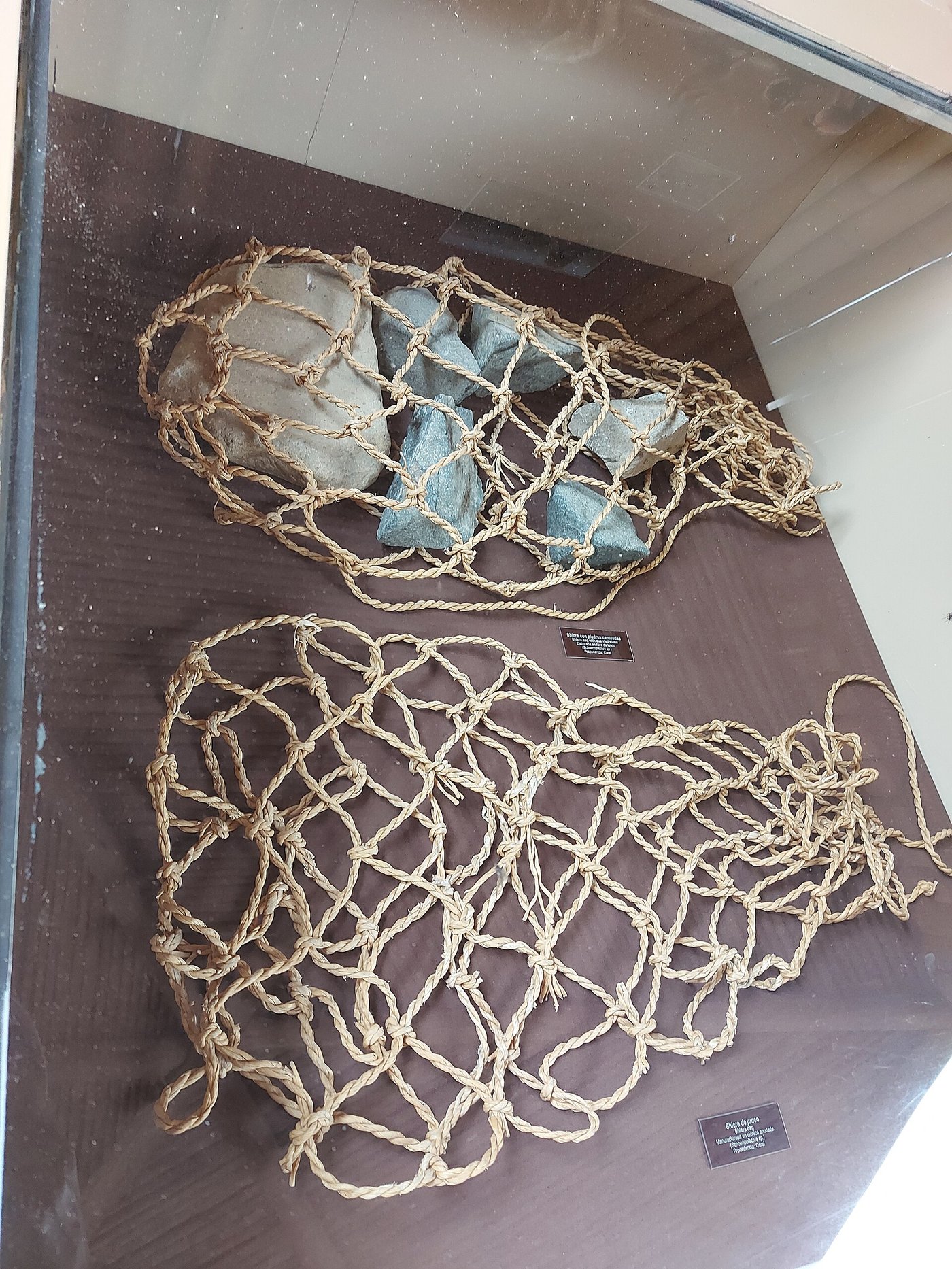 Exposed shicra bags at Caral: woven fibre sacks packed with stones, used as structural fill inside the platforms