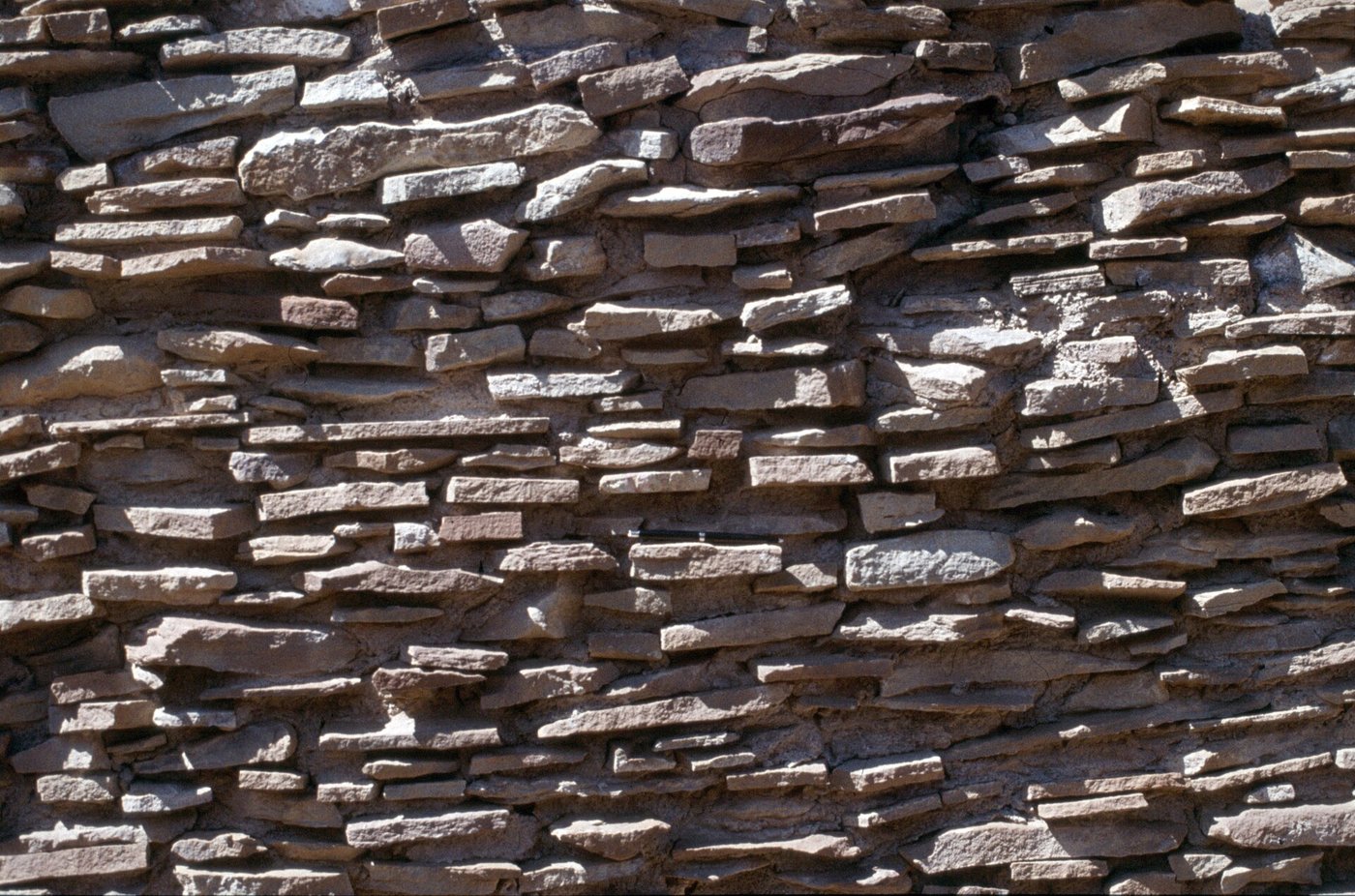 Close view of Chacoan core-and-veneer masonry, a rubble core faced with fitted sandstone