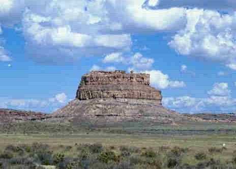 Fajada Butte rising from the floor of Chaco Canyon under a wide sky