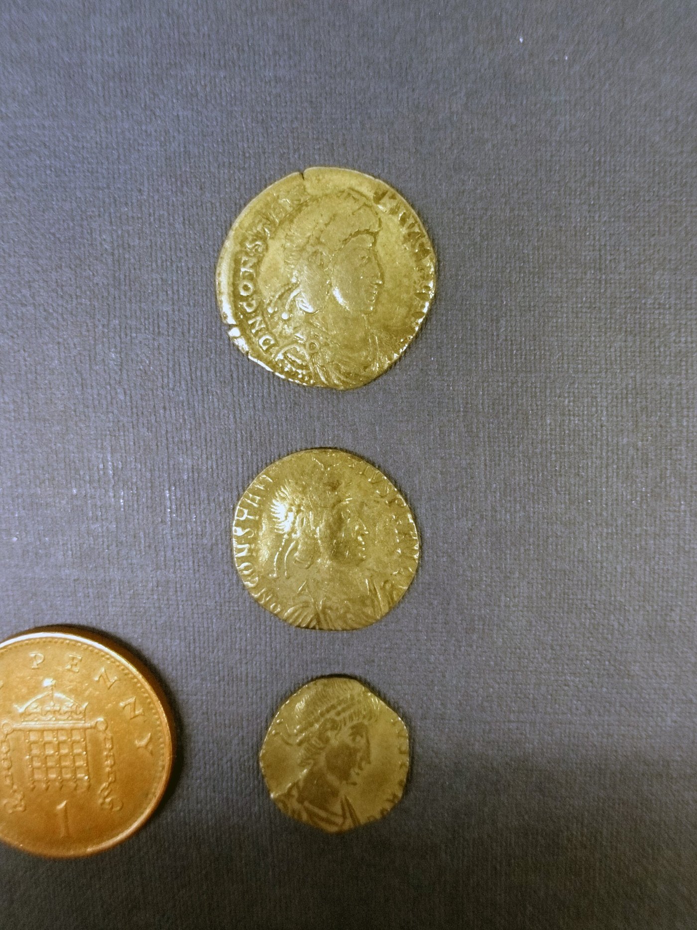 Roman bronze and silver coins from the Hoxne Hoard in Suffolk, illustrating the everyday currency in circulation in Roman Britain