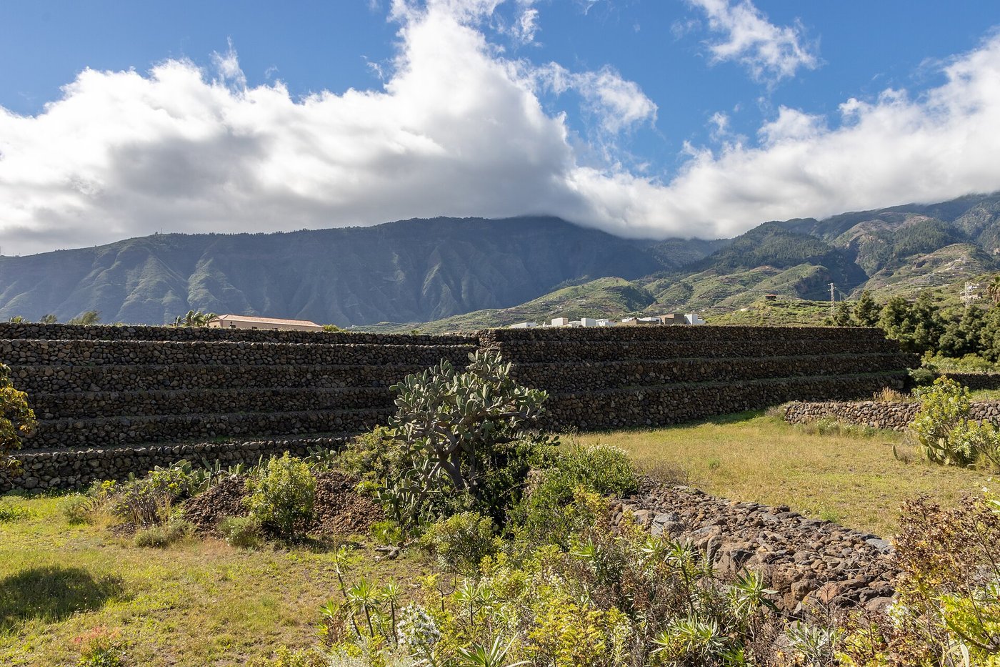 The stepped stone terraces known as the Pyramids of Guimar on Tenerife, built of dark volcanic rock