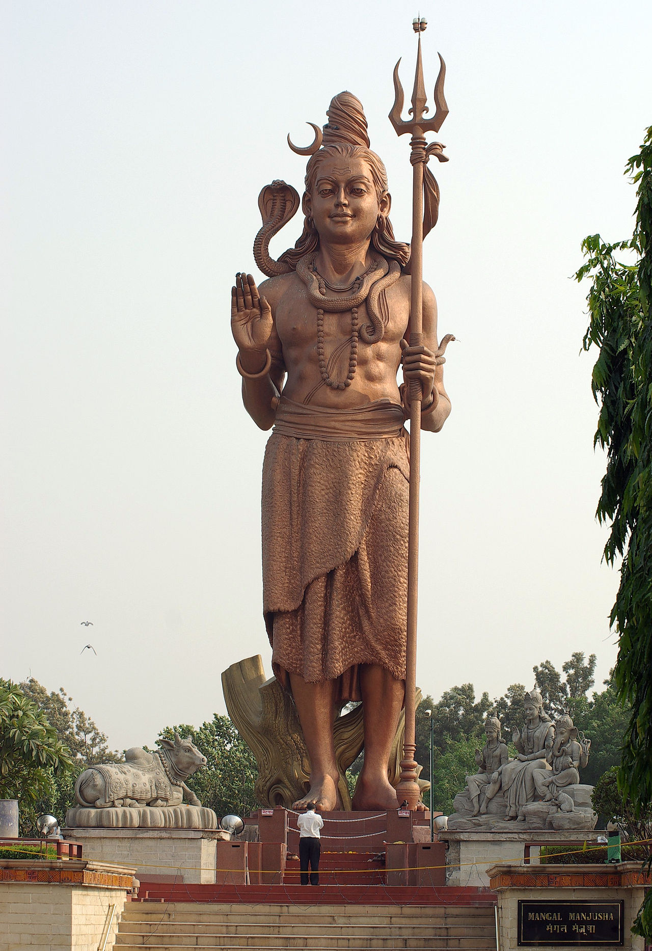A statue of Shiva holding the Trishula, his trident