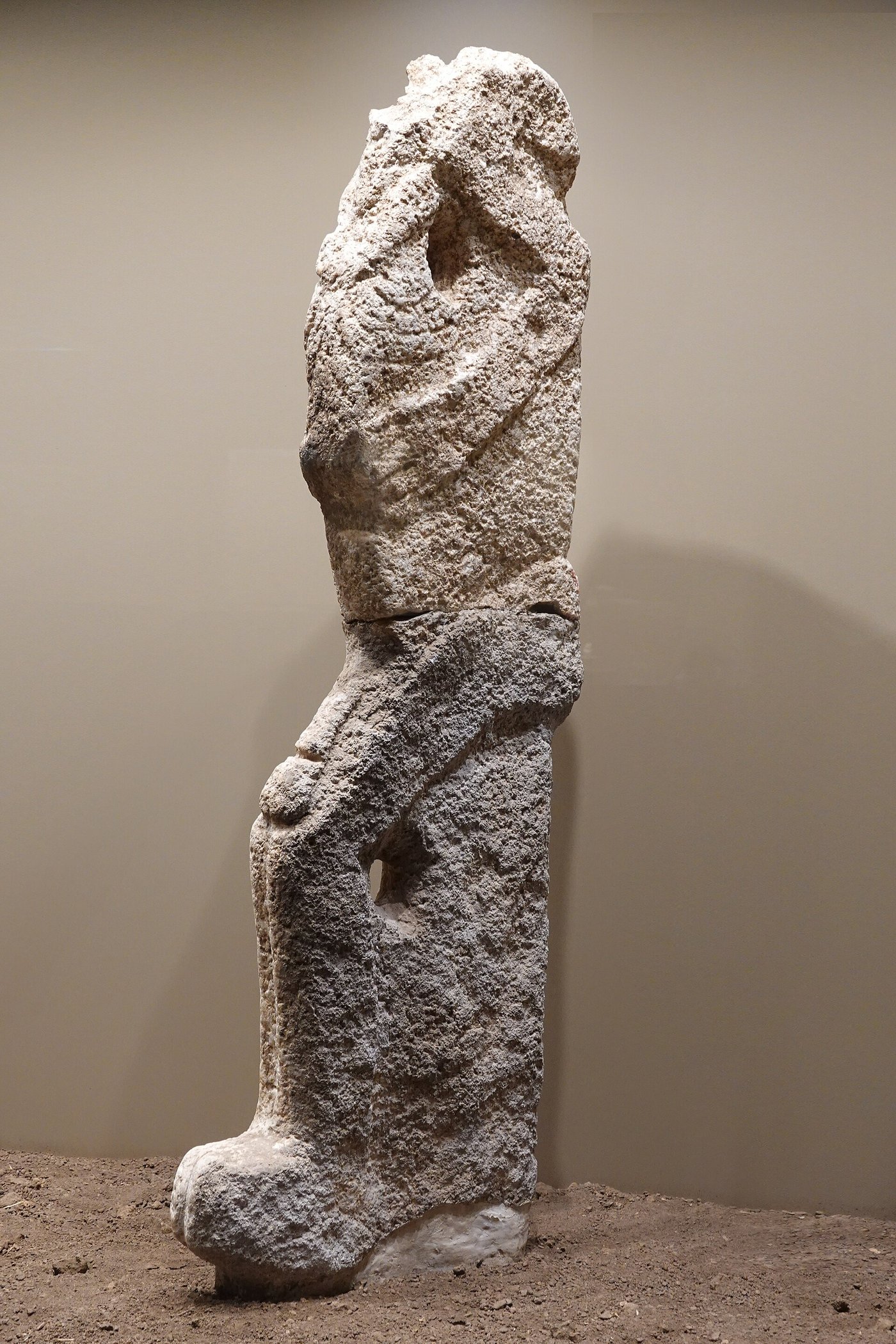 The life-size Neolithic seated male statue from Karahan Tepe on display in the Şanlıurfa museum