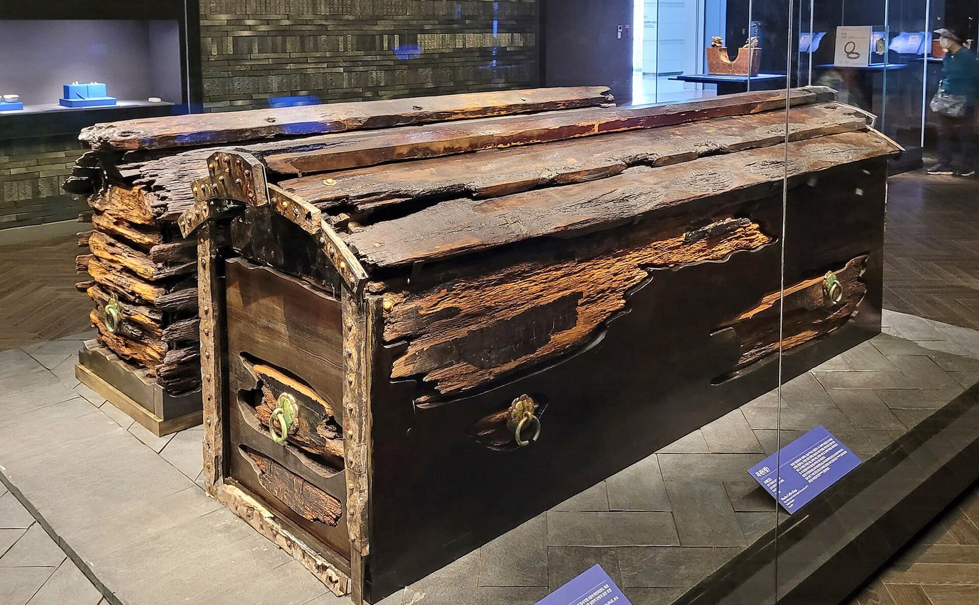 Reconstructed wooden coffins of King Muryeong and his queen, made from Japanese umbrella pine, displayed in a museum case