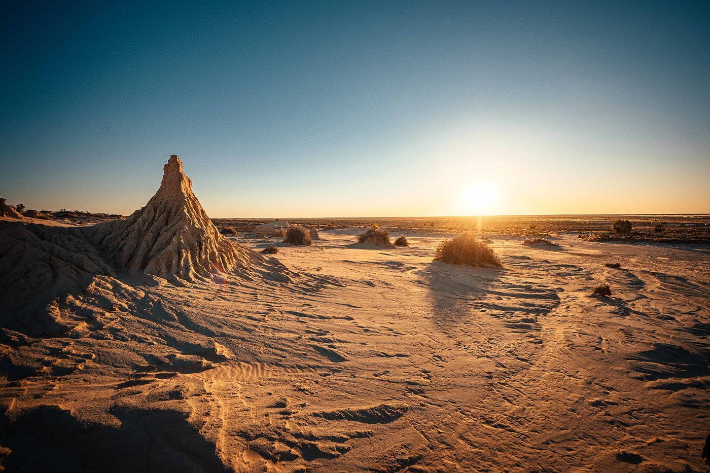 Eroded sand and clay formations of the Lake Mungo lunette against a blue sky