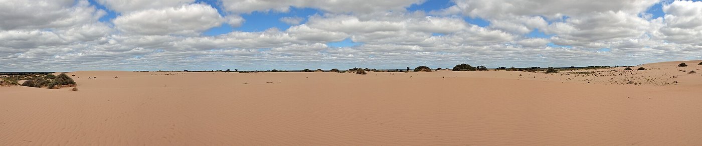 Panorama of the dry dunes and lakebed at Lake Mungo under a wide sky