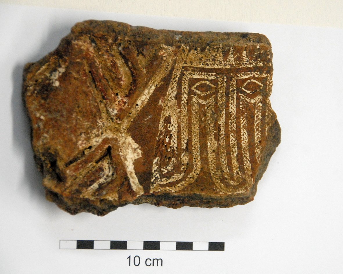 A Lapita pottery sherd from Fiji showing a stylised human face built from rows of fine stamped dots