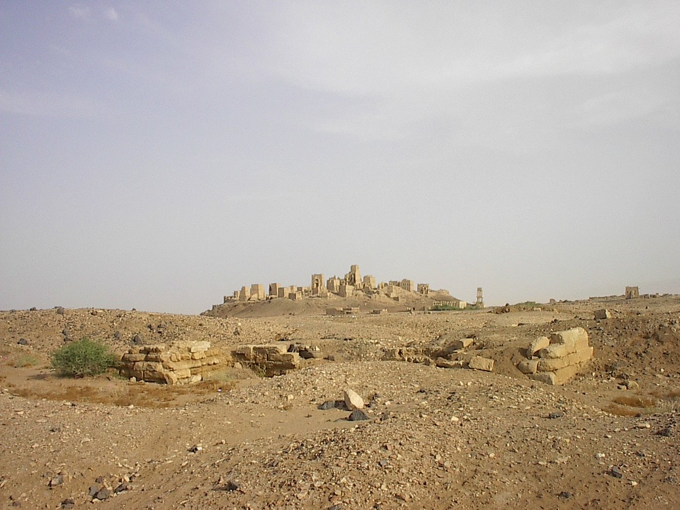 The mud-brick ruins of Old Marib rising on a mound above the plain