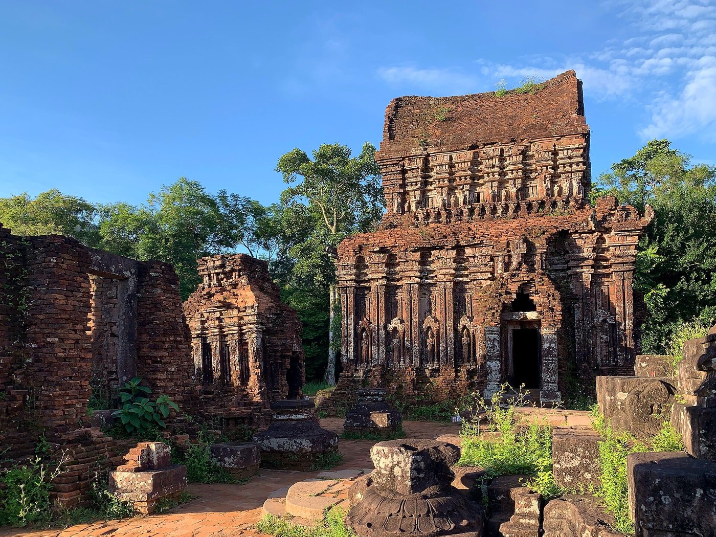 Brick temple towers of My Son groups B, C and D standing among green hills in central Vietnam