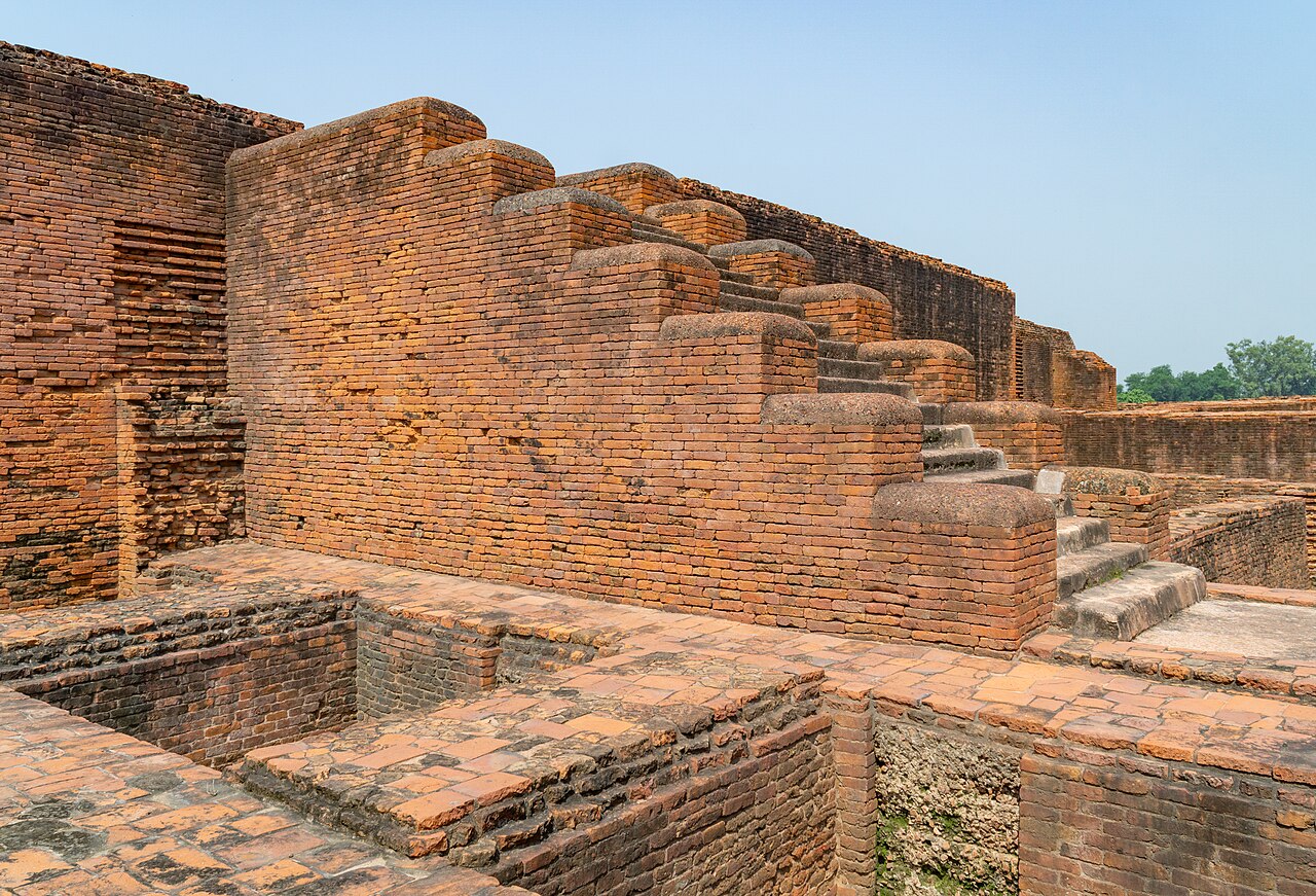 Excavated brick ruins of the monasteries at Nalanda, rows of monastic cells around a courtyard
