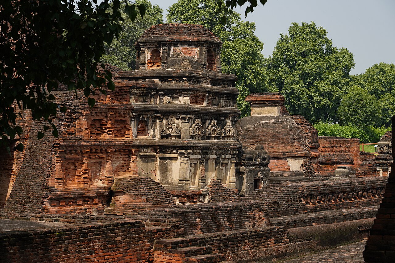 Stucco figures of Buddha and bodhisattvas in niches on the Sariputra Stupa at Nalanda
