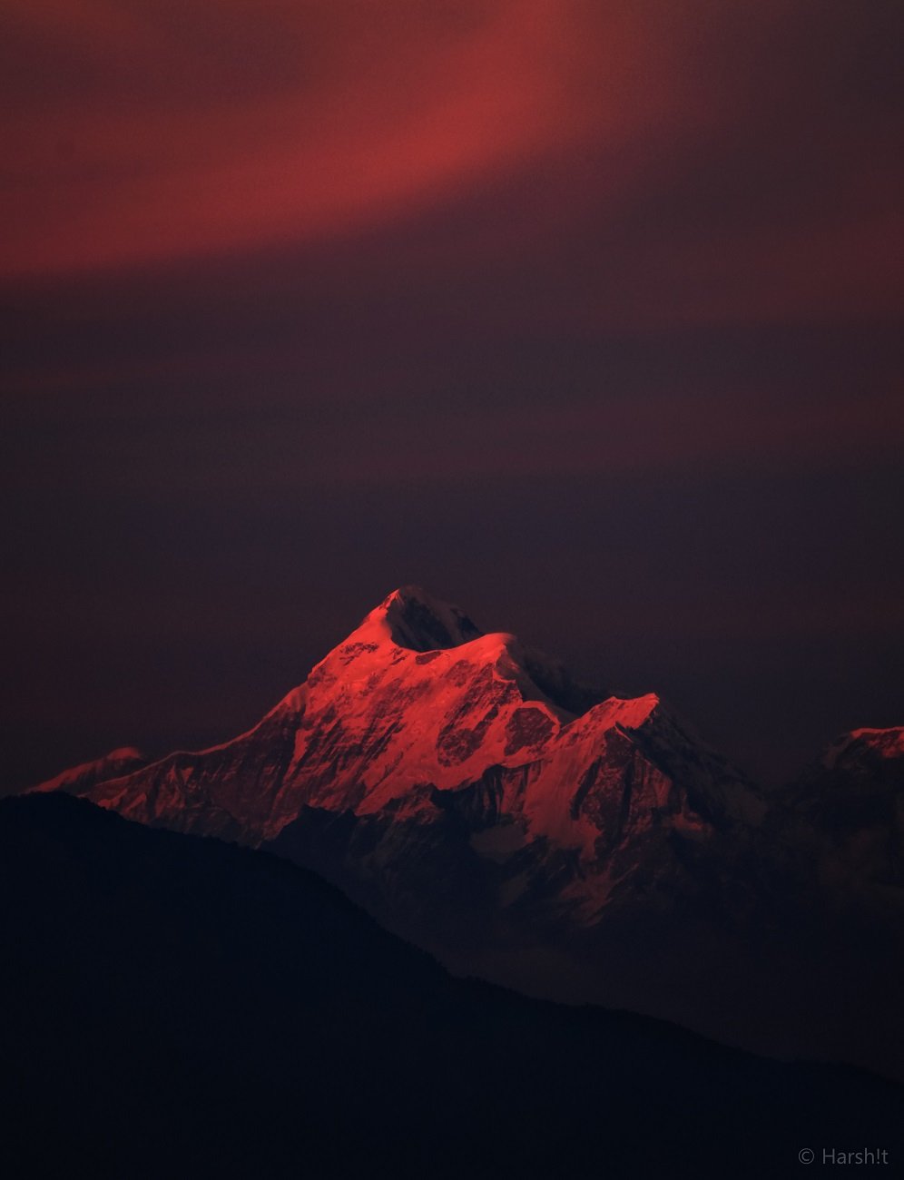 Alpenglow lighting the snow-capped Himalayan peak of Trisul near Roopkund at dusk