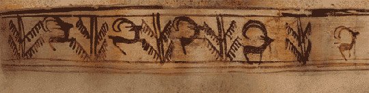 A grey pottery goblet from Shahr-e Sukhteh painted with five images of a wild goat springing towards a tree.