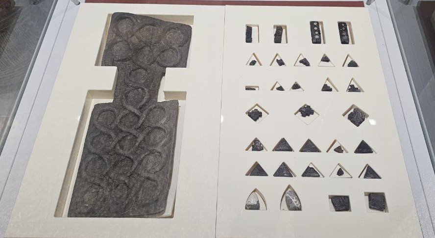 The Bronze Age board game from Shahr-e Sukhteh, a serpent coiled across twenty squares with playing pieces and dice.