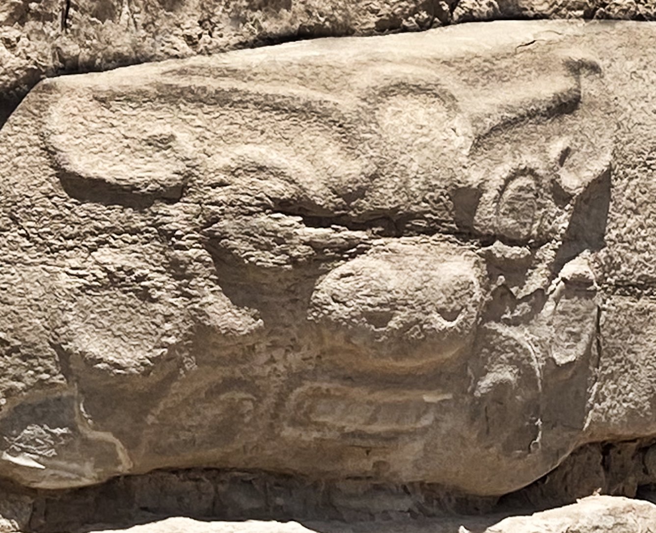 Carved stone human figure from the Shimao Neolithic site with stylised face and body