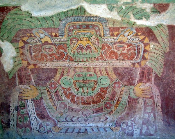 A Teotihuacan wall mural in red pigment showing a frontal deity figure with an elaborate headdress, streams issuing from the hands.