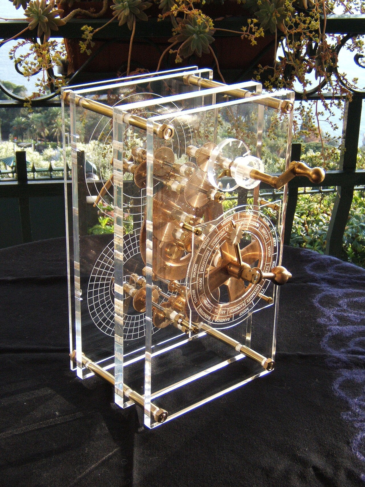 A modern reconstruction of the front panel of the Antikythera mechanism, showing the dial face and gearing