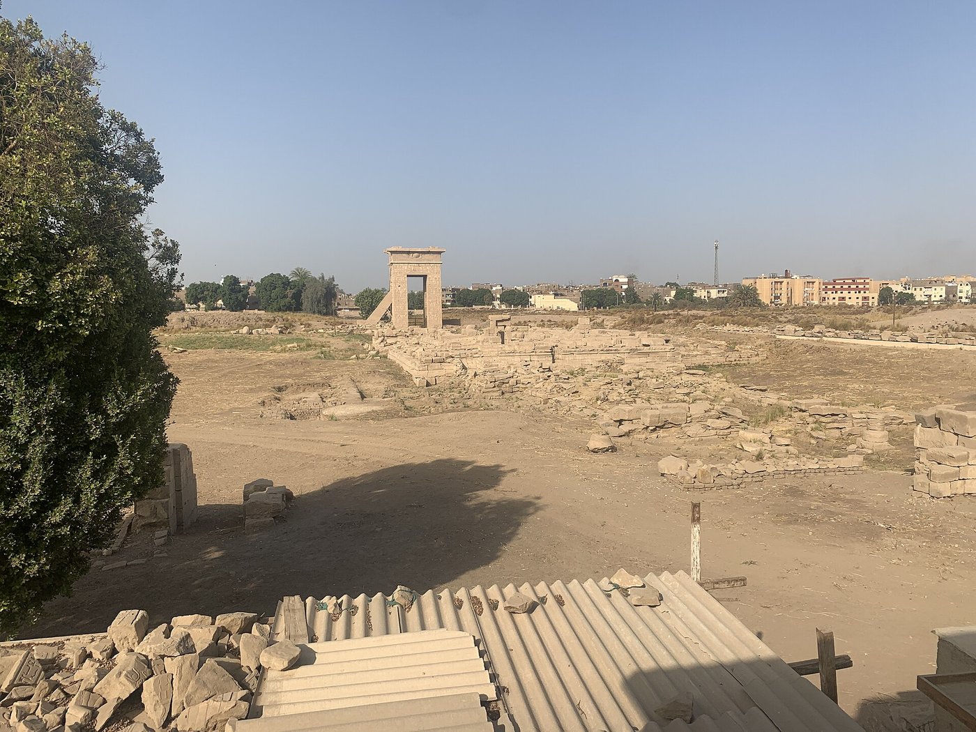 Ruined stone walls, column bases and scattered blocks in the precinct of Montu at the northern end of Karnak