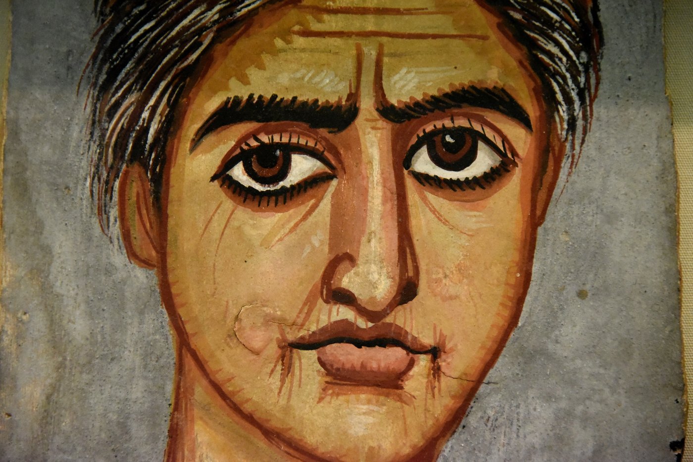Painted Roman-Egyptian mummy portrait of a woman from Fayum, encaustic on wood, third century CE