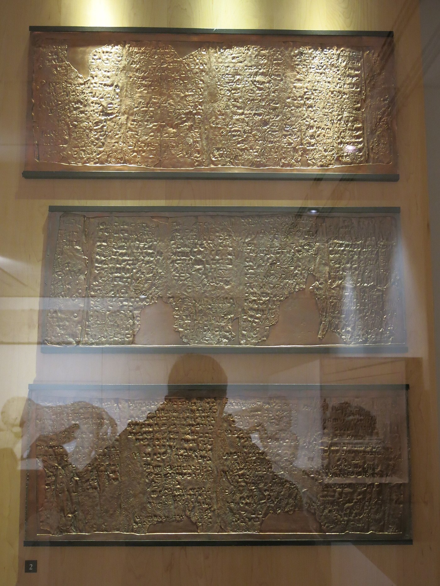 A full facsimile of the unrolled Copper Scroll laid out flat showing all its columns