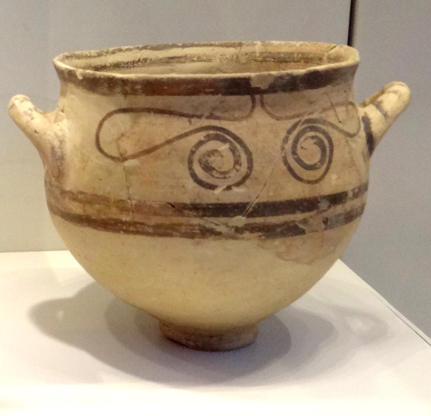 A decorated Philistine bichrome pottery vessel with painted bands and motifs