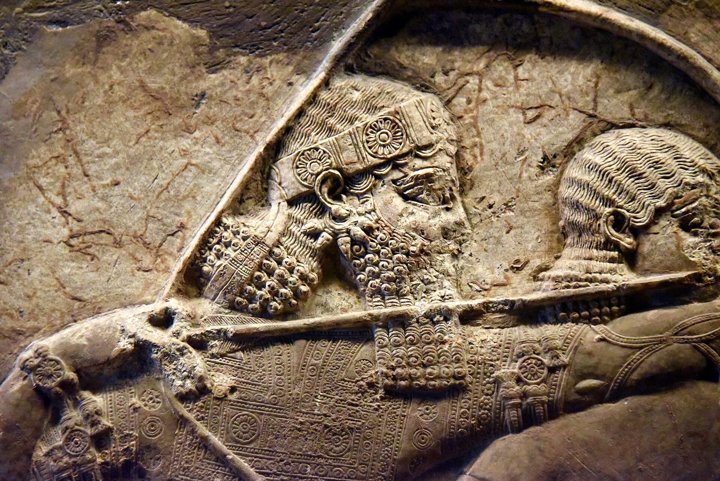 Assyrian stone relief showing King Ashurbanipal in a lion hunt scene from the North Palace at Nineveh