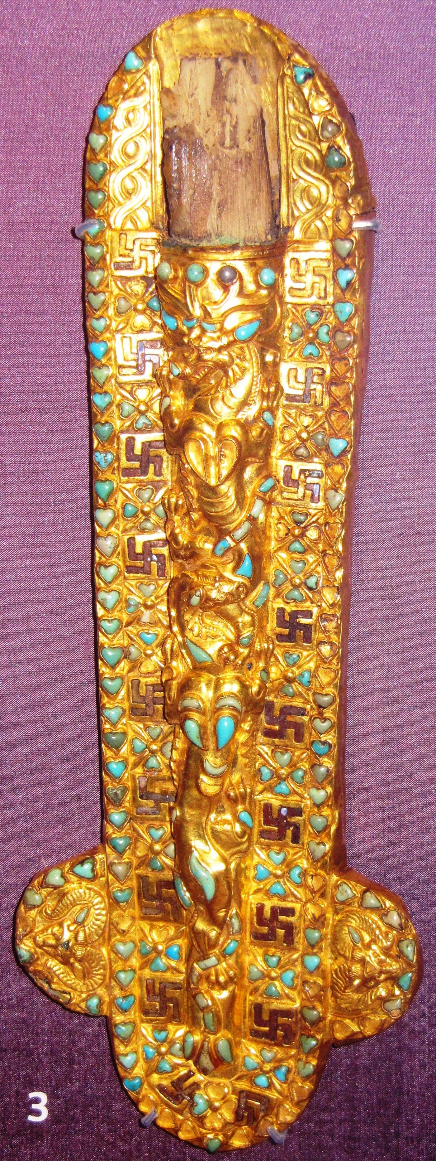 Gold dagger sheath from Tillya Tepe decorated with a procession of intertwined animals