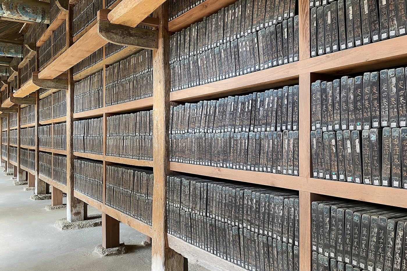 Rows of wooden printing blocks shelved on their edges inside the Haeinsa depository