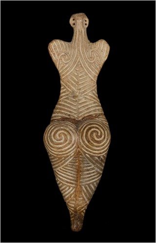 A small clay Cucuteni-Trypillia female figurine incised with fine lines suggesting tattoos or clothing