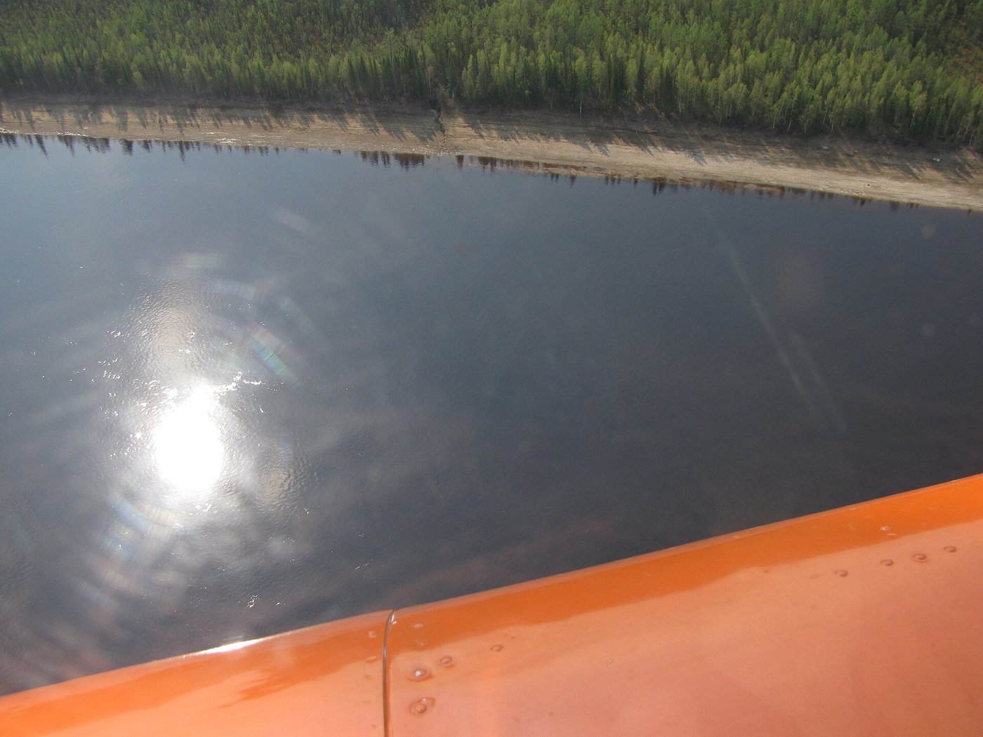 The Podkamennaya Tunguska River winding through dense Siberian taiga, seen from the air