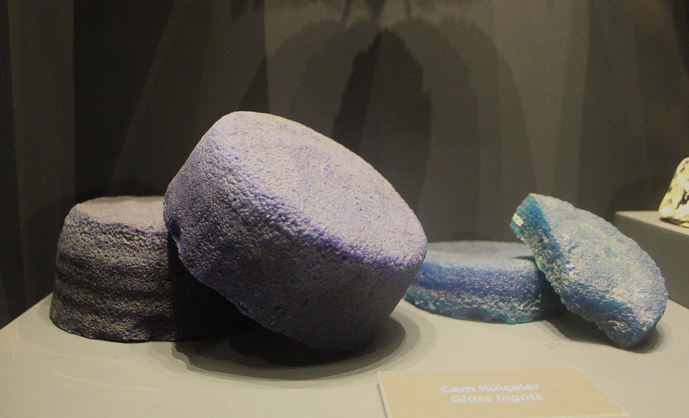 Deep blue and turquoise raw glass ingots recovered from the Uluburun shipwreck
