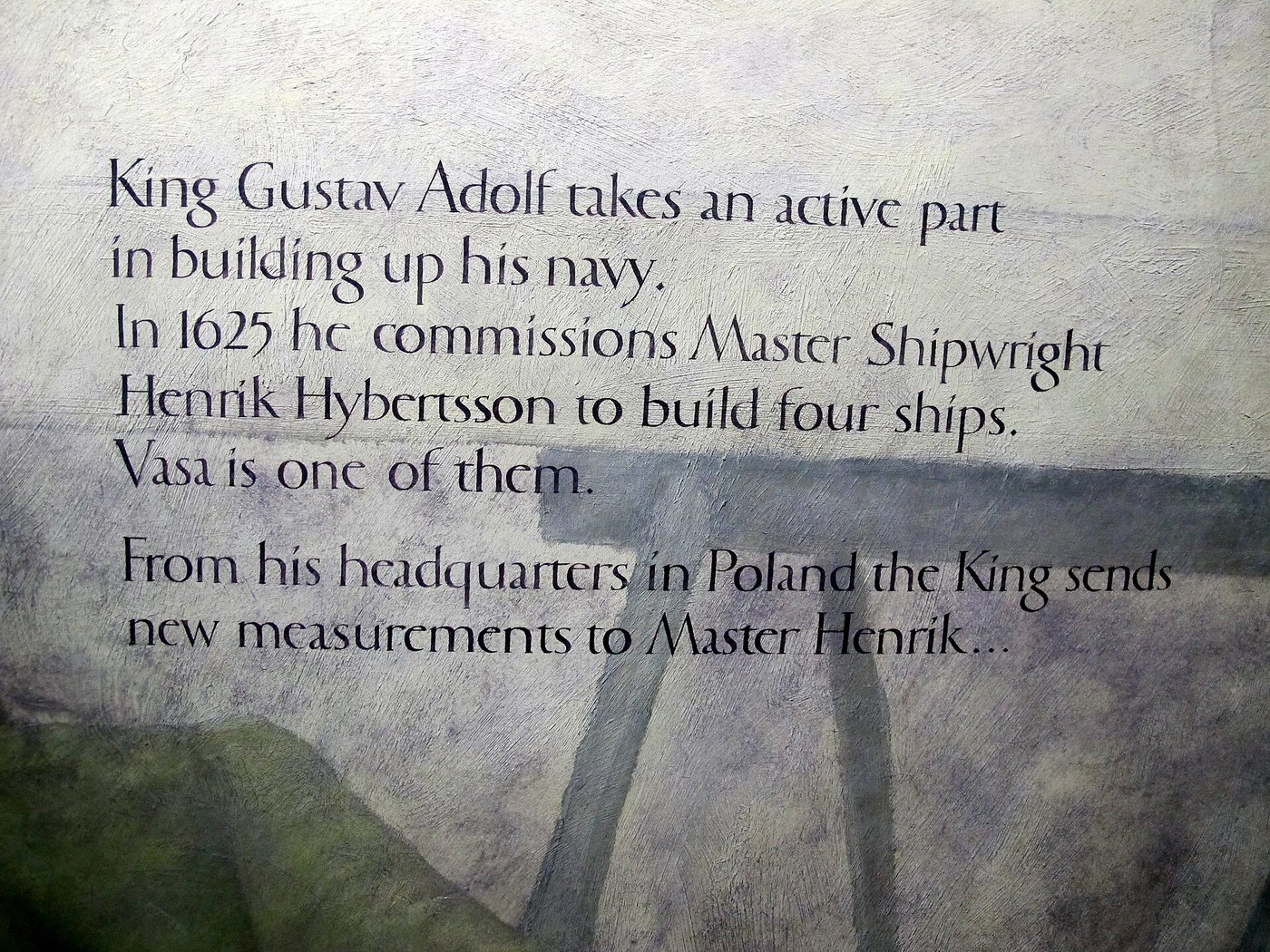 The salvaged Vasa on display in the Vasa Museum, dark timber hull and masts rising towards the roof