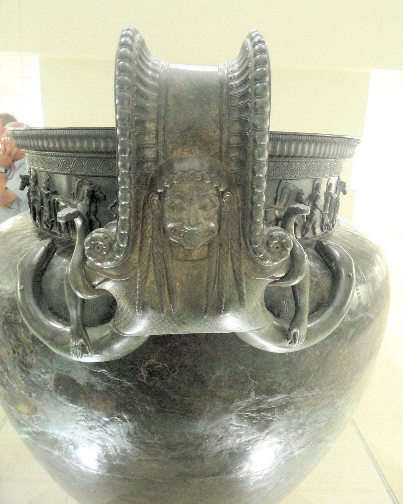 One of the bronze handles of the Vix krater, formed as a coiled volute topped by the snarling face of a Gorgon with protruding tongue