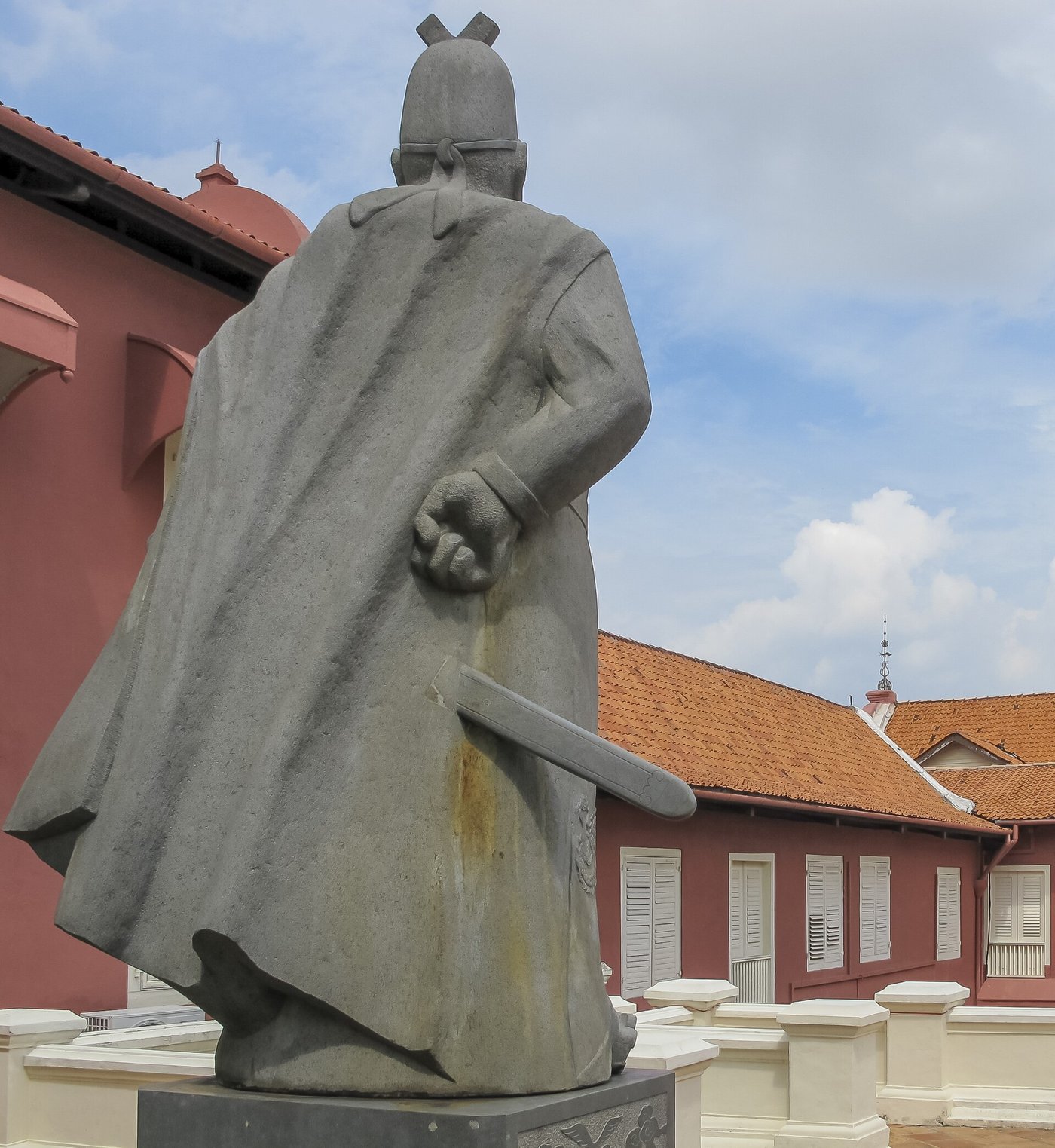 A large statue of Admiral Zheng He in Melaka, Malaysia, showing him in robes with his hand raised