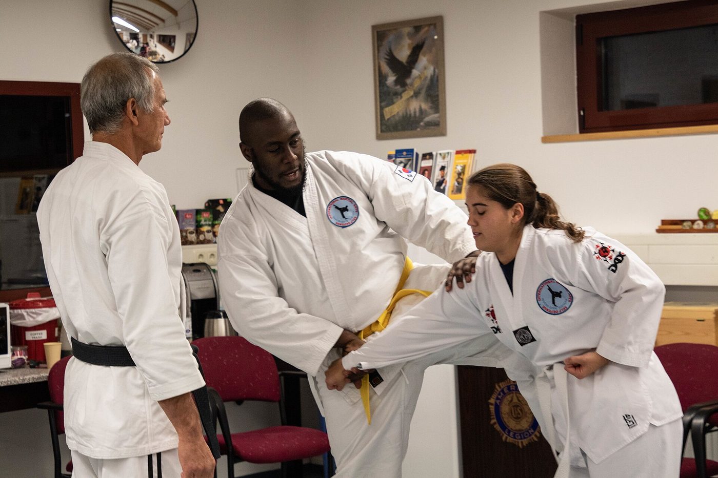 An instructor demonstrating a self-defence technique in a class